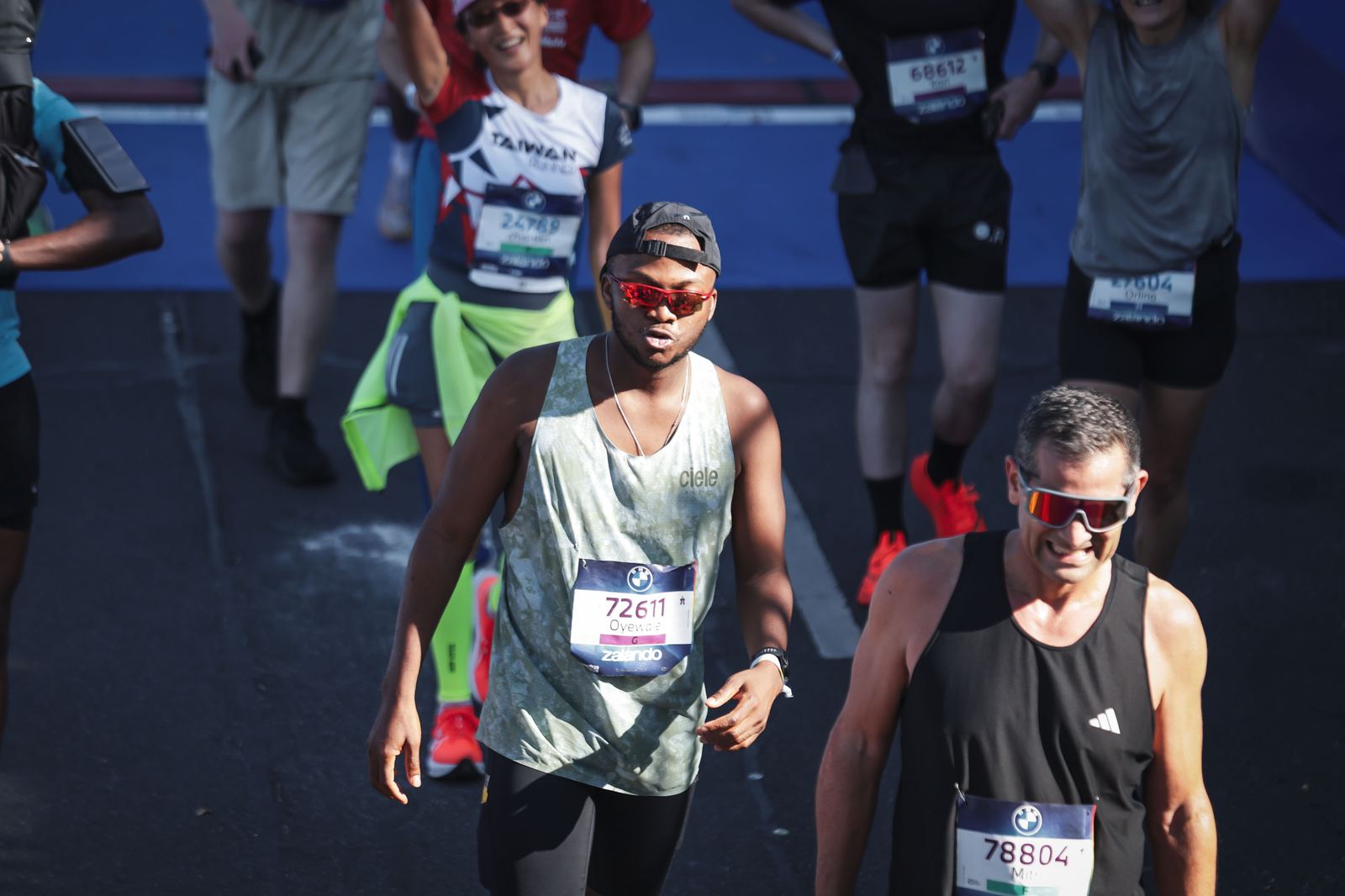 Walking through the finish area just after crossing the line